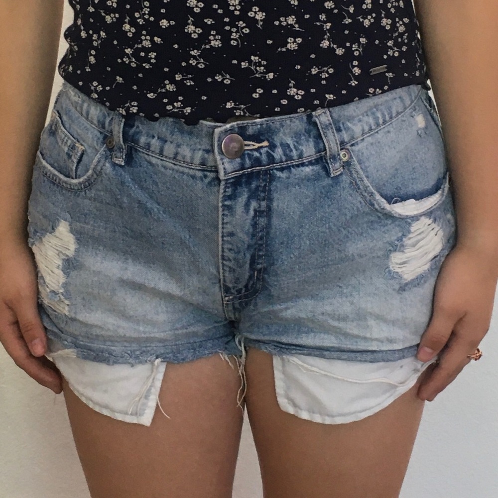 Ripped light wash denim shorts